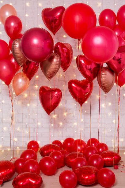 istock Valentine's day background - red air balloons over brick wall 1277777999