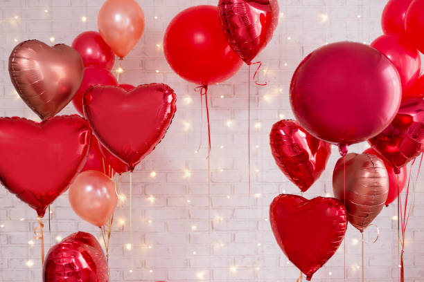 istock Valentine's day background - red circle and heart shaped foil balloons 1277778003