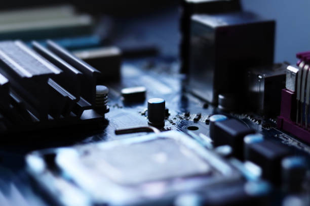 istock Blurred computer motherboard closeup in tilt shift style with selective focus. Defocused computer parts background 1277779141