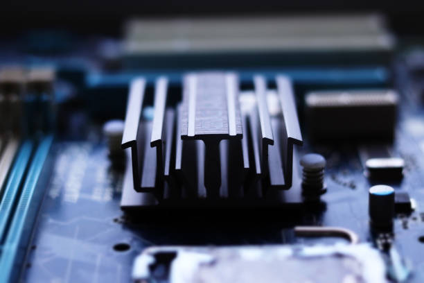 istock Blurred computer motherboard closeup in tilt shift style with selective focus. Defocused computer parts background 1277779180