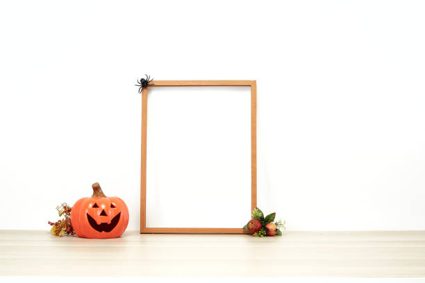 istock Halloween frame with  jack o lantern decoration a desk 1277782238