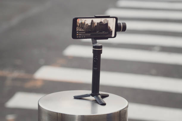 istock Phone with stabilizer, tripod, gimbal taking photo or video 1277782376