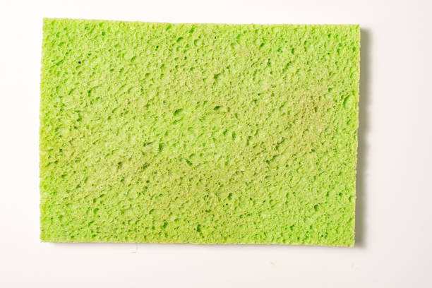 old used sponge for washing dishes old used sponge for washing dishes on a light background porous sponge stock pictures, royalty-free photos & images