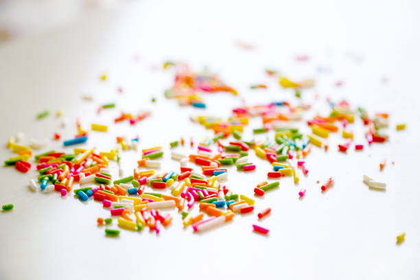 istock Selective focus colorful sugar sprinkle dots for decoration topping cake and ice cream on the table. 1277785247