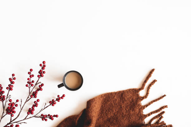 Autumn composition. Cup of coffee, plaid on white background. Autumn, fall concept. Flat lay, top view