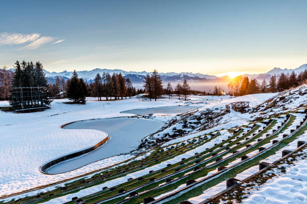 Winter background. Snow, icy water, trees and mountain. Winter background. Snow, icy water, trees and mountain in Crans Montana in Switzerland. Tranquil scene. Beauty in nature. crans montana stock pictures, royalty-free photos & images