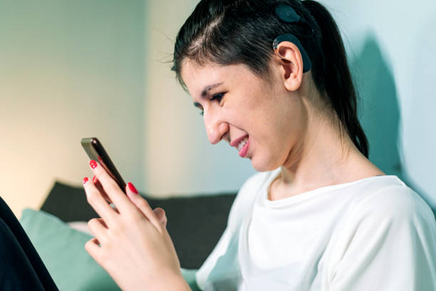 istock Beautiful young woman with cochlear implant 1277787413