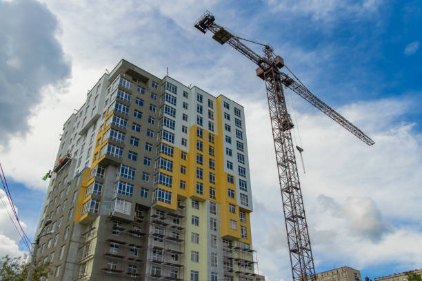 istock construction high building landmark industrial process with crane urban picture foreshortening from below 1277794604