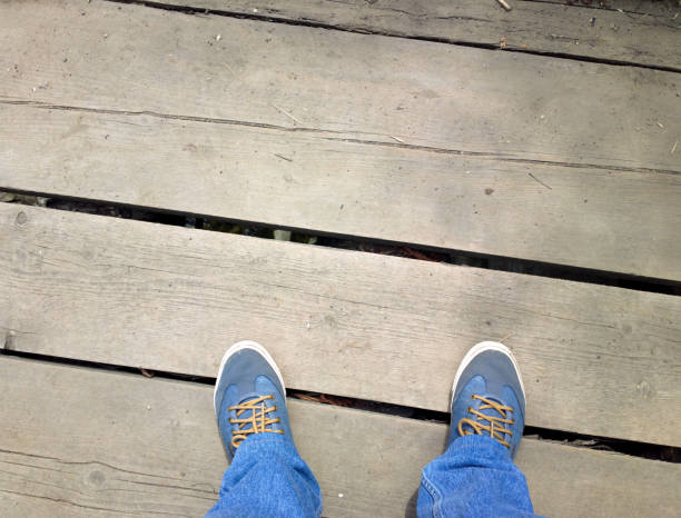 istock Feet on a wooden bridge. 1277794653