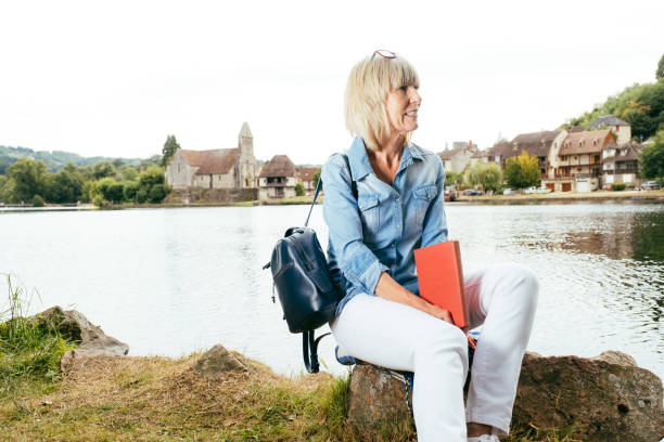 istock Book reading at Beaulieu sur Dordogne, France 1277798061