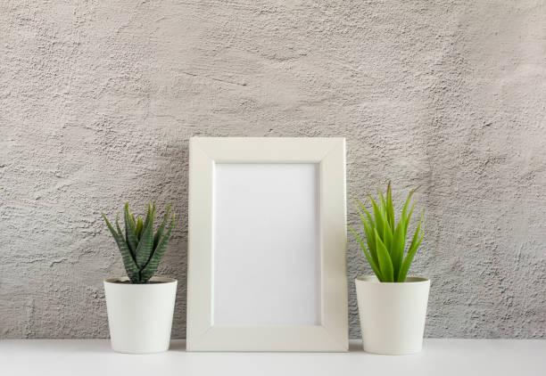 istock Empty photo frame on a table or shelf with a copy of the place 1277800455