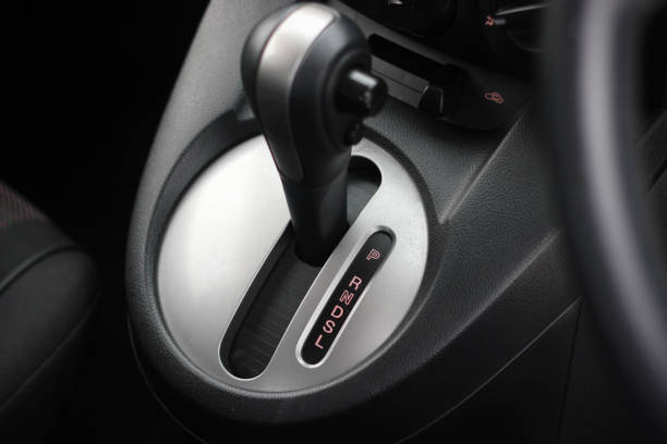 istock automatic transmission shift selector in the car interior. Closeup a manual shift of modern car gear shifter. 1277800490
