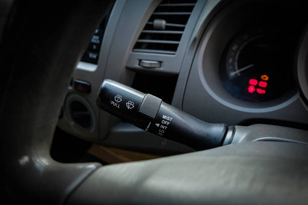 istock Windscreen wiper control switch in car. Wipers control. Modern car interior detail. adjusting speed of screen wipers in car. 1277800721
