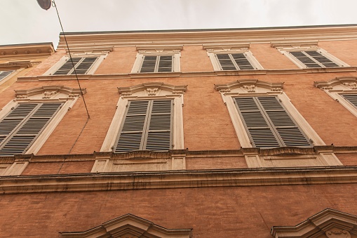 Historic building facade detail in Modena city, Italy