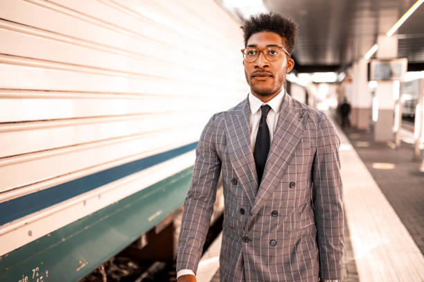 istock Elegant businssman at the train station. 1277801053