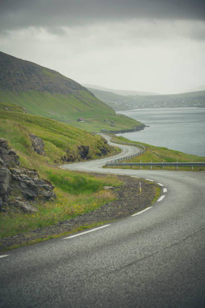 istock winding road to the north atlantic ocean, faroe islands 1277802571