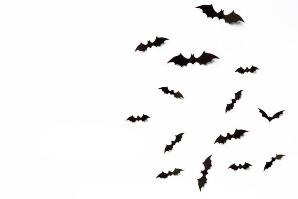 istock Flying bats group isolated on white background.  Halloween symbols. 1277802651