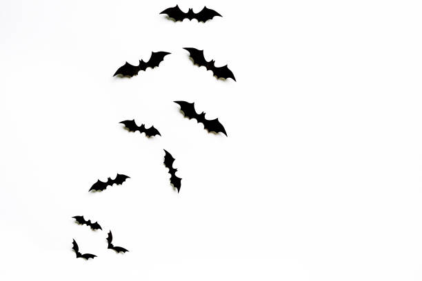 istock Flying bats group isolated on white background.  Halloween symbols. 1277802652