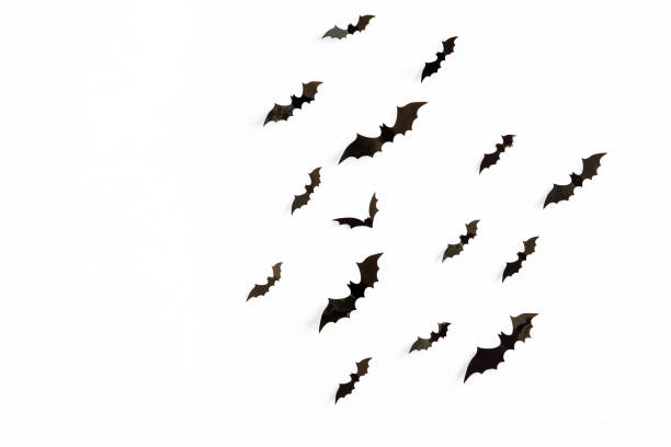 istock Flying bats group isolated on white background.  Halloween symbols. 1277802668