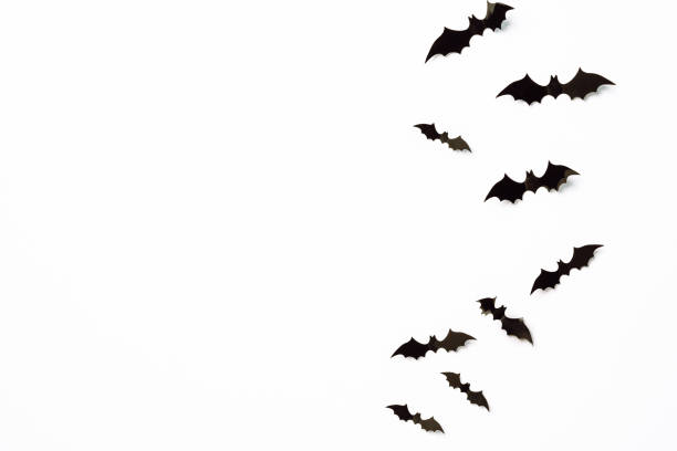 istock Flying bats group isolated on white background.  Halloween symbols. 1277802686