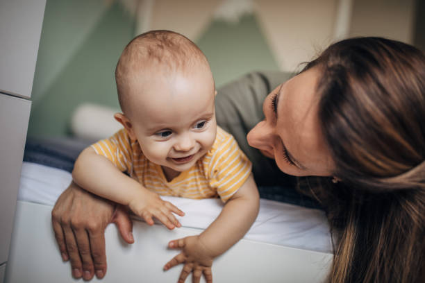 istock Mother cuddling with her baby boy 1277804169