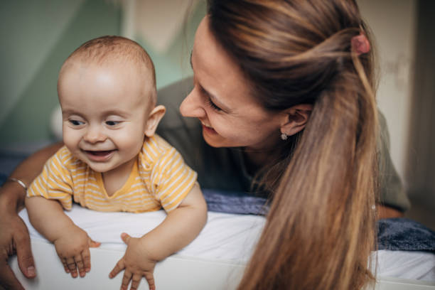 istock Young mother cuddling with her baby son 1277804215