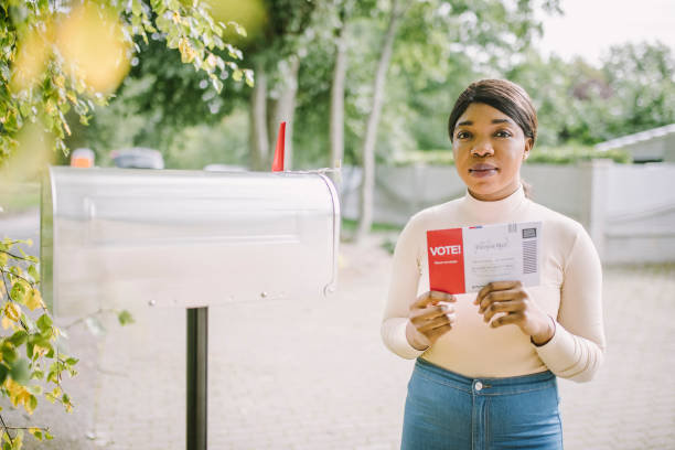 istock Woman with voting ballot 1277806213