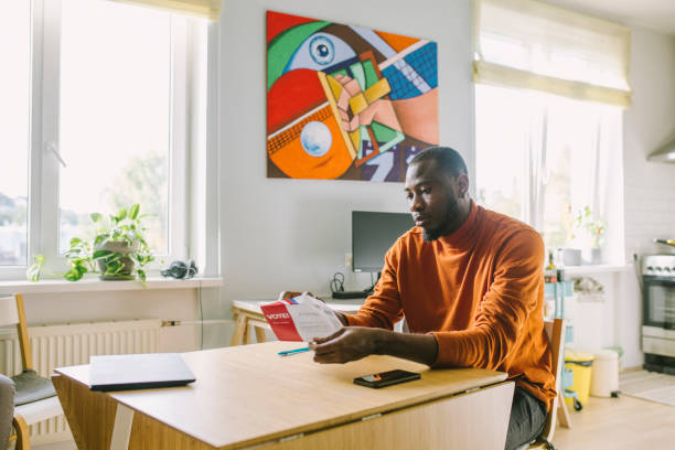 istock African-American man opening US voting ballot 1277806237