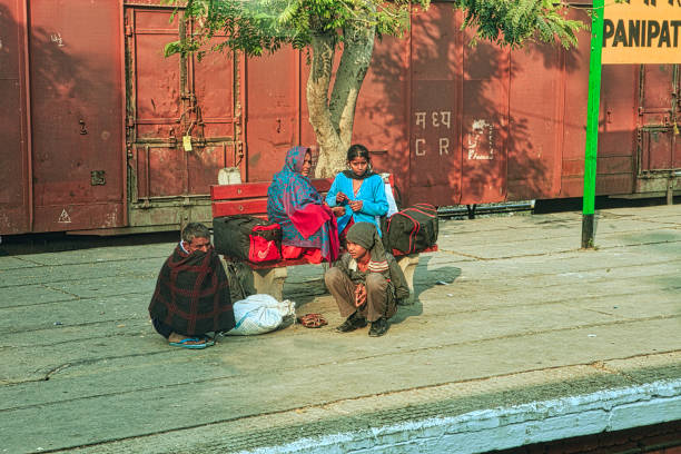 Ahmedabad, India - September 27, 2011 : Women dressing in traditional sari from Ahmedabad city of Gujarat sitting and relaxing together under the tree 