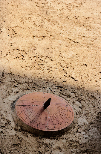 ancient wall sundial. the time is coming.
