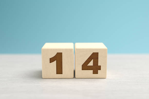 istock Wooden toy blocks forming the number 14. 1277809952