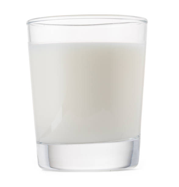 istock Glass of milk isolated on white background 1277810385