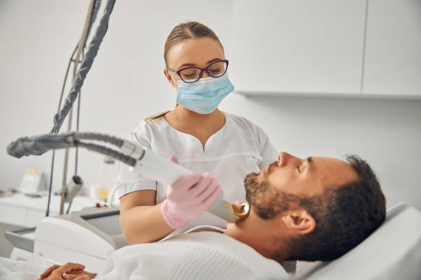 istock Unshaven young man undergoing laser hair removal procedure 1277812104