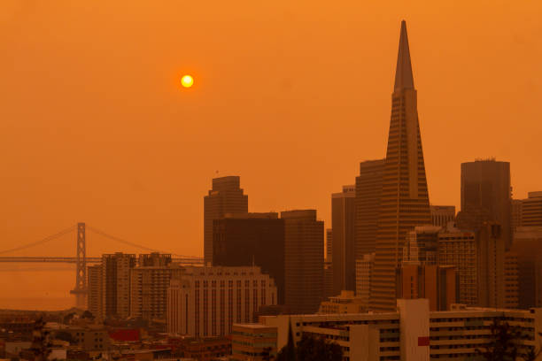 San Francisco Orange Sky during California Forest Fire Unhealthy air in downtown San Francisco due to the Napa 
 Glass fire. wildfire smoke stock pictures, royalty-free photos & images