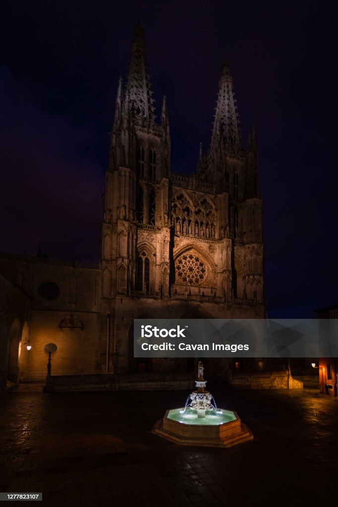 Night view of a fountain and in the background the gothic facade Night view of a fountain and in the background the gothic facade in Burgos, CL, Spain Architecture Stock Photo
