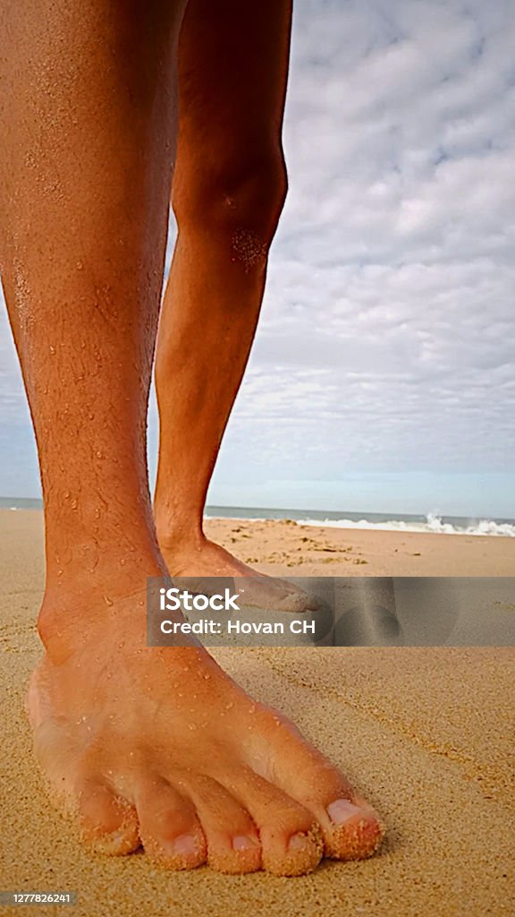 Male barefoot Feet in the sand Adult Stock Photo