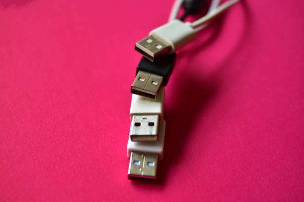 istock Black and white USB connectors on top of each other on a red background 1277826338