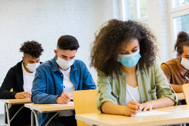istock Students at the lecture during coronavirus pandemic 1277827010