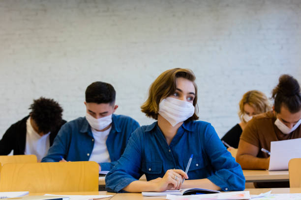 istock Students at the lecture during coronavirus pandemic 1277827276
