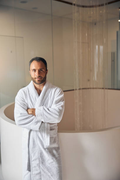 istock Good-looking young man standing at wellness center 1277827376
