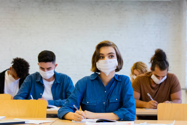 istock Students at the lecture during coronavirus pandemic 1277828667