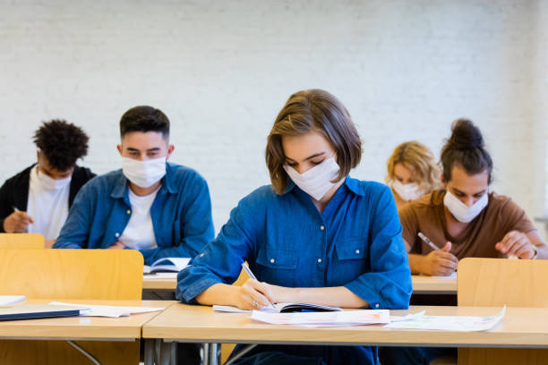 istock Students at the lecture during coronavirus pandemic 1277828945