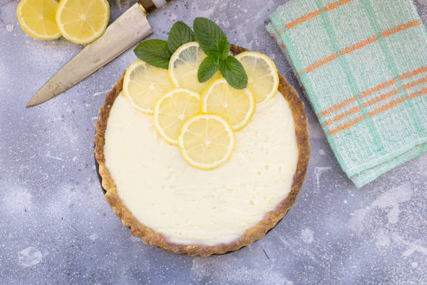 istock Fresh and homemade lemon pie or tart on rustic background 1277831149