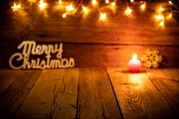 istock Christmas background red candle on rustic old wood 1277831247