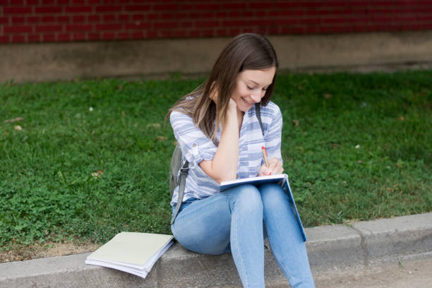 istock Happy student girl in the park 1277831644