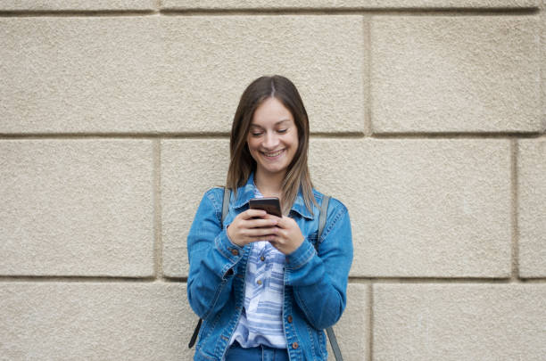 istock Young woman with smart phone 1277831762