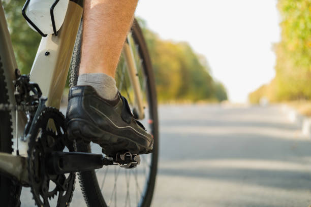 istock Bicycle shoes with clipless pedals on the crankset, copy space view. 1277831787