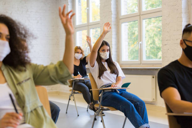 istock Students wearing face mask at the lecture 1277833867