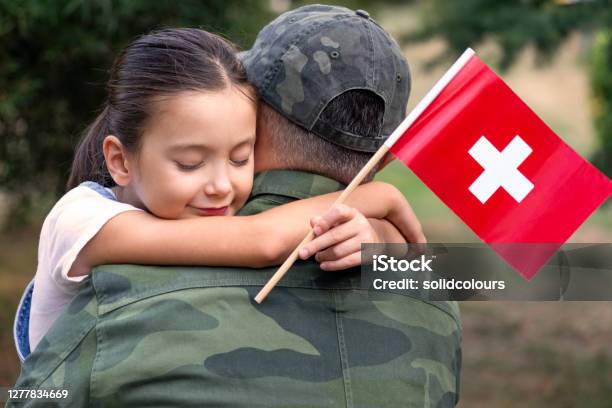 Swiss Soldier And His Daughter Stock Photo - Download Image Now - Swiss Military, 6-7 Years, Adult