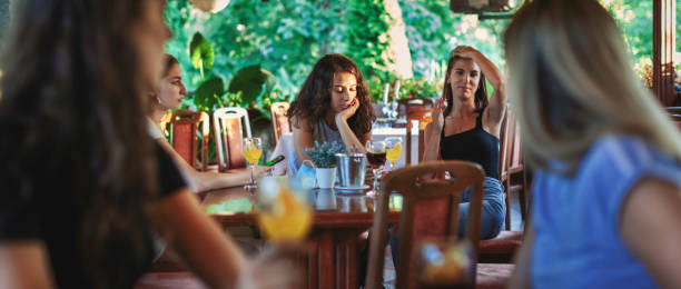 istock Friends talking and having fun together at fancy cafeteria 1277835814